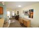 Bright office/den with desk and tiled floor, blending seamlessly into living spaces at 861 Tall Oaks Ct. # D-61, Myrtle Beach, SC 29588