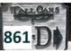 Close-up of the community sign displaying the unit number 