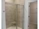 Bathroom featuring glass shower with tile walls and a walk in closet at 8719 Baton Rouge Ave Nw, Calabash, NC 28467