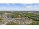 An aerial view pointing to the property, showcasing the beautiful homes and serene lake at 886 Carolina Farms Blvd., Myrtle Beach, SC 29579