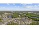 An aerial view showing community homes surrounded by lush trees and serene lakes and water features at 886 Carolina Farms Blvd., Myrtle Beach, SC 29579