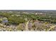 Community aerial view showcases lush landscaping, serene ponds, and well-maintained homes in a desirable location at 886 Carolina Farms Blvd., Myrtle Beach, SC 29579