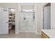 Bathroom with a walk-in shower, tile floor, and an open closet with built-in shelving at 886 Carolina Farms Blvd., Myrtle Beach, SC 29579