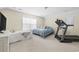 Cozy bedroom featuring two beds, a window, and a treadmill for convenient exercise at 886 Carolina Farms Blvd., Myrtle Beach, SC 29579