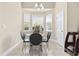 Cozy breakfast nook with a glass table, bay window, and tiled flooring at 886 Carolina Farms Blvd., Myrtle Beach, SC 29579