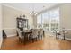 Formal dining room with elegant chandelier, hardwood floors and large windows at 886 Carolina Farms Blvd., Myrtle Beach, SC 29579