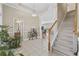 Inviting foyer with tile flooring, staircase, and views of the living spaces at 886 Carolina Farms Blvd., Myrtle Beach, SC 29579