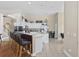 Modern kitchen with white cabinets, granite countertops, and a breakfast bar at 886 Carolina Farms Blvd., Myrtle Beach, SC 29579