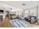 Open-concept living space with hardwood floors and ample seating areas at 886 Carolina Farms Blvd., Myrtle Beach, SC 29579