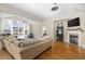 Bright living room with hardwood floors, fireplace, and views of outdoor space at 886 Carolina Farms Blvd., Myrtle Beach, SC 29579