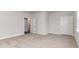 Bedroom with neutral paint colors, carpeting, and a doorway leading to another room at 889 Ireland Dr., Longs, SC 29568