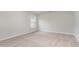 Carpeted bedroom with neutral paint, base trim, a window and modern electrical outlets at 889 Ireland Dr., Longs, SC 29568