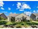 Lovely backyard featuring a screened porch, well-maintained landscaping and a grassy lawn at 9169 Nw Oldfield Rd., Calabash, NC 28467
