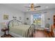 Comfortable bedroom with hardwood floors, a ceiling fan, and bright windows for a cozy feel at 9169 Nw Oldfield Rd., Calabash, NC 28467