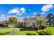 Charming home with a lush front yard, a rock garden, and a welcoming covered porch at 9169 Nw Oldfield Rd., Calabash, NC 28467