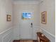 Bright entryway with a white front door and stylish decor for a welcoming ambiance at 9169 Nw Oldfield Rd., Calabash, NC 28467