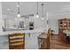 Kitchen featuring a center island with pendant lighting, stainless appliances and a view of a china cabinet at 9169 Nw Oldfield Rd., Calabash, NC 28467
