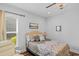 Serene bedroom with soft bedding, lots of sunlight, and a cozy armchair for relaxation at 9169 Nw Oldfield Rd., Calabash, NC 28467