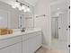 Bright bathroom featuring a white vanity, large mirror, and access to the shower at 93 Knotty Pine Way, Murrells Inlet, SC 29576