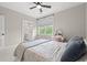 Well-lit bedroom with ceiling fan, vanity, and ensuite bathroom at 93 Knotty Pine Way, Murrells Inlet, SC 29576