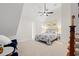 Comfortable bedroom with slanted ceiling, soft carpet, ceiling fan, and two bedside tables at 93 Knotty Pine Way, Murrells Inlet, SC 29576