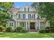 Charming two-story home with inviting front porch, columns and landscaped yard at 93 Knotty Pine Way, Murrells Inlet, SC 29576