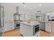 Bright kitchen featuring stainless steel appliances, modern cabinetry, and center island at 93 Knotty Pine Way, Murrells Inlet, SC 29576