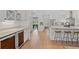 Spacious kitchen with white cabinets, stainless appliances, wine cooler, and an open floor plan at 93 Knotty Pine Way, Murrells Inlet, SC 29576