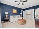 Sophisticated living room features a ceiling fan, soft carpet, and plenty of natural light at 93 Knotty Pine Way, Murrells Inlet, SC 29576