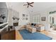 Bright living room featuring vaulted ceiling, brick fireplace, and plush sectional sofa at 93 Knotty Pine Way, Murrells Inlet, SC 29576