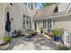 Inviting outdoor patio with comfortable seating and lush landscaping at 93 Knotty Pine Way, Murrells Inlet, SC 29576