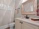 Elegant powder room with vanity, decorative mirror, and floral accents at 93 Knotty Pine Way, Murrells Inlet, SC 29576
