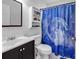 Bathroom featuring vanity, toilet, and shower with a blue celestial-themed curtain at 9450 Leeds Circle, Myrtle Beach, SC 29588