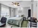Relaxing bedroom featuring a comfortable bed, ceiling fan, window and stylish decor at 9450 Leeds Circle, Myrtle Beach, SC 29588