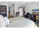 Well-lit bedroom offering a bed, desk, TV, and organized shelving for comfortable living at 9450 Leeds Circle, Myrtle Beach, SC 29588