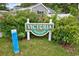 Green Victoria Station sign surrounded by lush foliage at 9450 Leeds Circle, Myrtle Beach, SC 29588