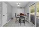 Dining room with tile floors, a view to the outside, and neutral wall colors at 9450 Leeds Circle, Myrtle Beach, SC 29588
