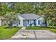 Charming single-story home with blue shutters and a well-maintained front yard at 9450 Leeds Circle, Myrtle Beach, SC 29588