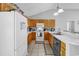 Functional kitchen featuring a white refrigerator, light-colored cabinets, and modern appliances at 9450 Leeds Circle, Myrtle Beach, SC 29588