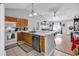 Open kitchen featuring a breakfast bar, wooden cabinets, and an adjacent living space at 9450 Leeds Circle, Myrtle Beach, SC 29588