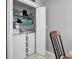 Bright laundry room with white washer and dryer, wire shelving, and ample storage space at 9450 Leeds Circle, Myrtle Beach, SC 29588