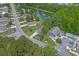 Aerial view of a neighborhood with water features, green spaces, and a well-maintained landscape at 100 Oak Leaf Dr., Longs, SC 29568