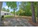 Expansive backyard featuring mature trees and a partial fence line at 100 Oak Leaf Dr., Longs, SC 29568