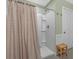 Bathroom featuring a shower with a patterned curtain, tiled floors, and a neutral color scheme at 100 Oak Leaf Dr., Longs, SC 29568