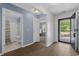 Open entryway showcasing a bathroom and bedroom with bright natural light and wood flooring at 100 Oak Leaf Dr., Longs, SC 29568