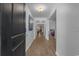 Hallway with wood floors with views to an open concept floor plan and neutral color palette at 100 Oak Leaf Dr., Longs, SC 29568