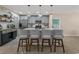 Kitchen island with seating, white quartz countertops, stainless steel appliances and open floor plan at 100 Oak Leaf Dr., Longs, SC 29568