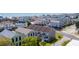 An aerial view shows a coastal townhome complex near ocean, and street access with colorful surrounding buildings at 112 3Rd Ave. S # B, Surfside Beach, SC 29575