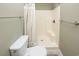 Cozy bathroom featuring a toilet and a walk-in shower with a shower curtain at 112 3Rd Ave. S # B, Surfside Beach, SC 29575