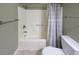 A bathroom has an updated bathtub and shower combination, a toilet, and neutral walls in the updated space at 112 3Rd Ave. S # B, Surfside Beach, SC 29575